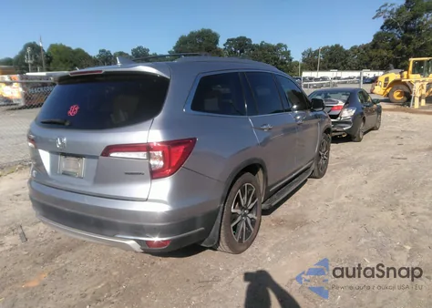 2021 Honda Pilot 2Wd Touring 7 Passenger z USA, uszkodzony, nr VIN 5FNYF5H69MB000710